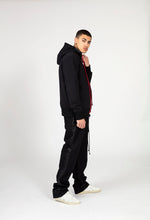 Load image into Gallery viewer, Male model in Black pants and classic hoodie neck luxury fashion Cotton hoodie front view red lace and red slick lining full side view